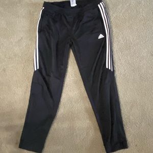 Black Adidas joggers with white stripe
